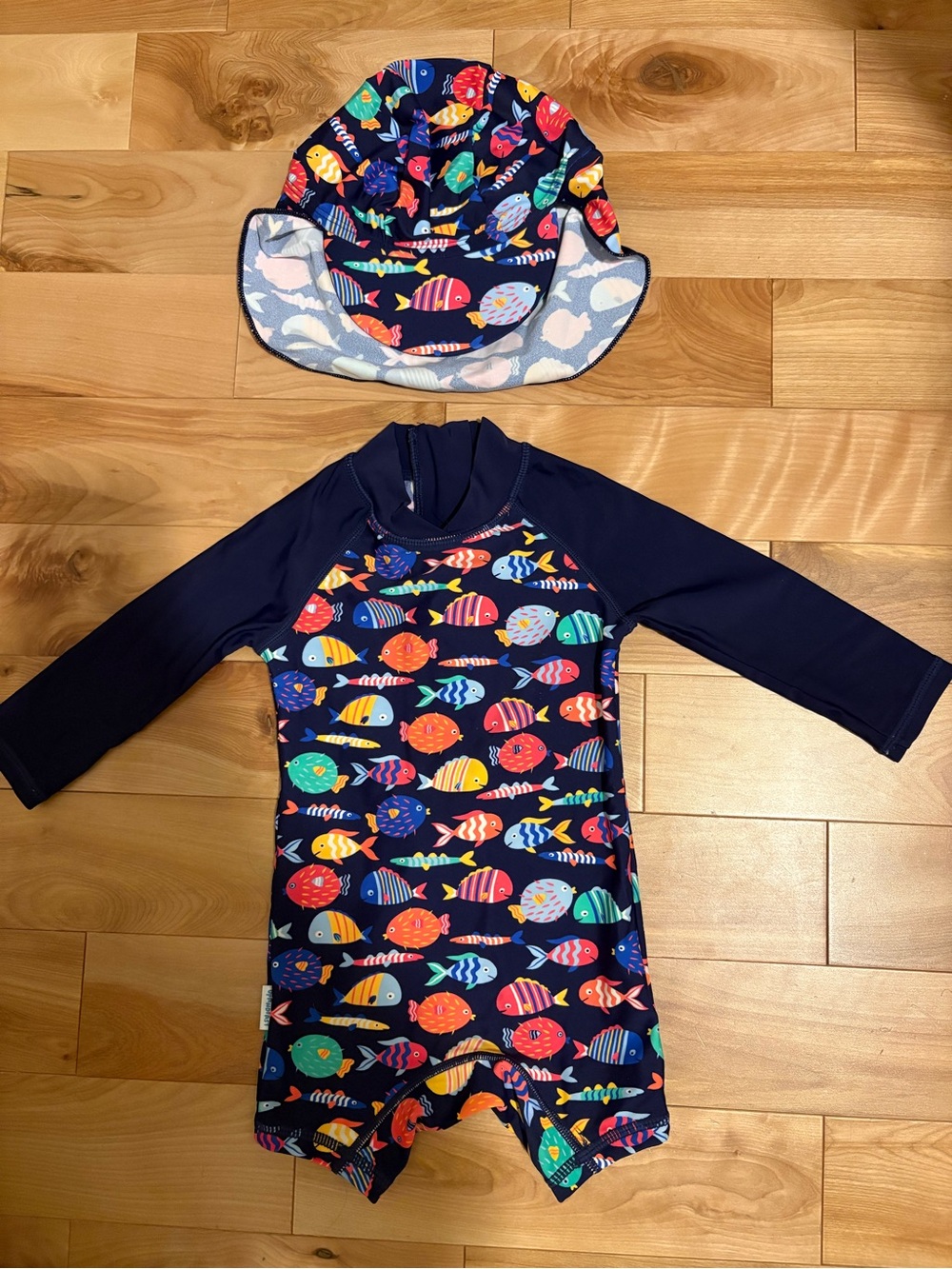 Up and Fast UPF 50+ swimsuit and hat in fish print, size 3-6m